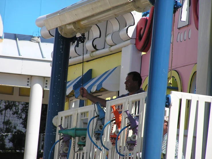 a man that is on top of a balcony