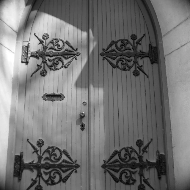 there is a large metal door in front of a building