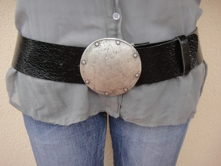 a belt with a buckle made of metal plates