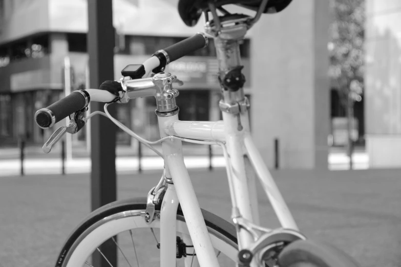 this is a black and white picture of a bicycle parked