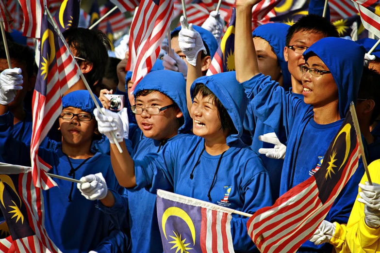 young s wave malaysian flags from their seats