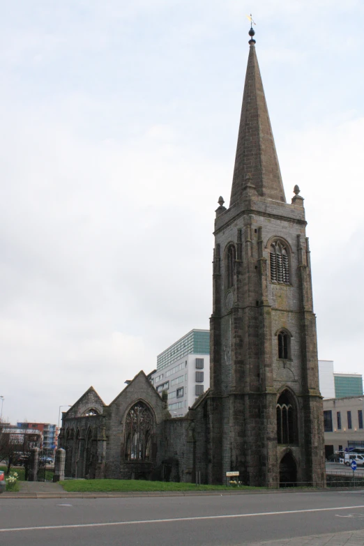 a very tall clock tower next to a brick building