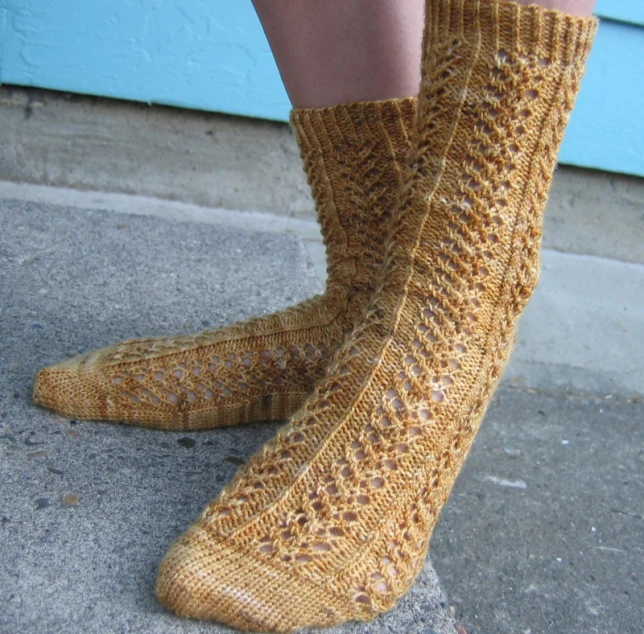 a woman's leg wearing short socks made from wool with small dots