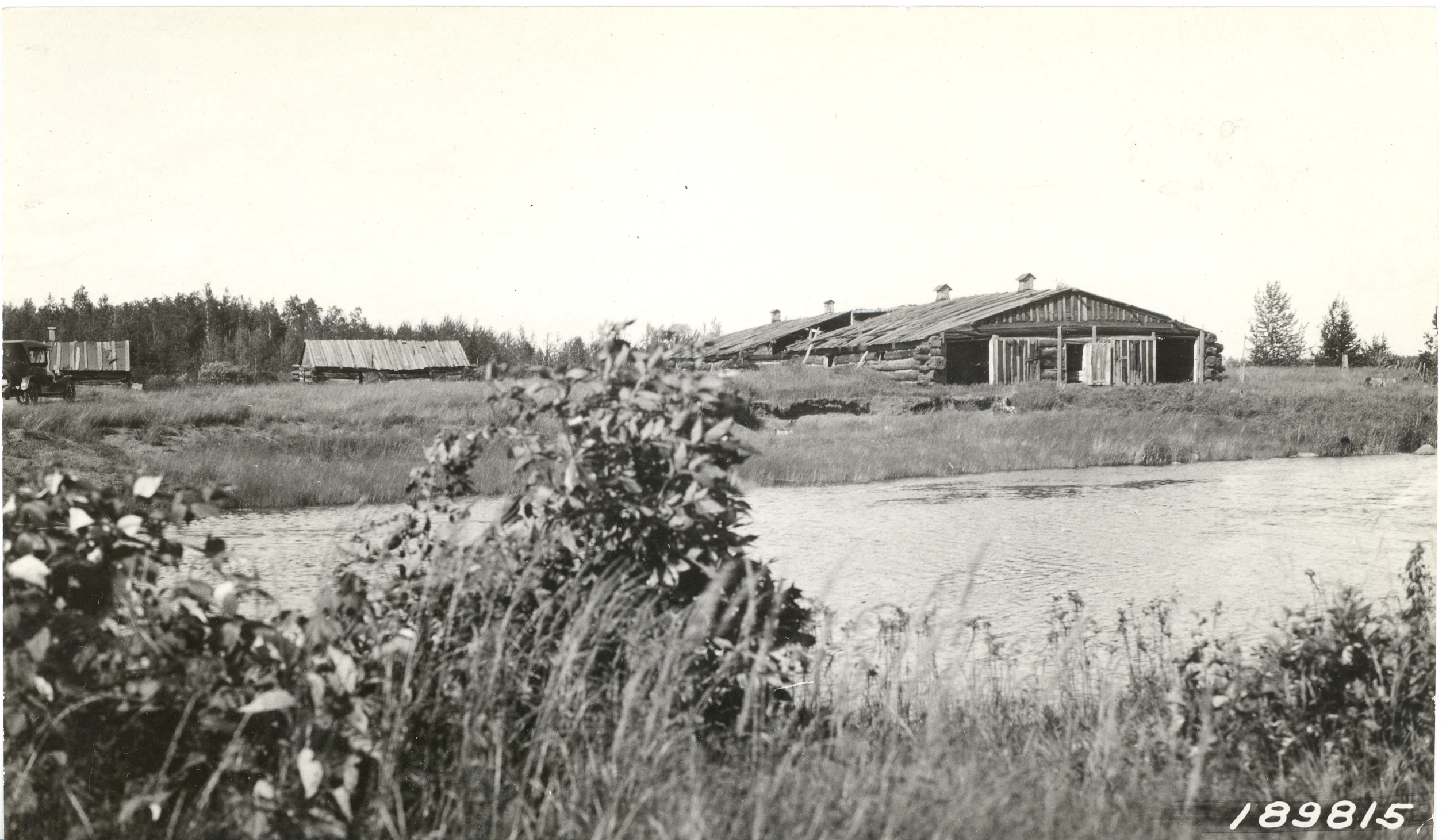 a farm house and a river in the field