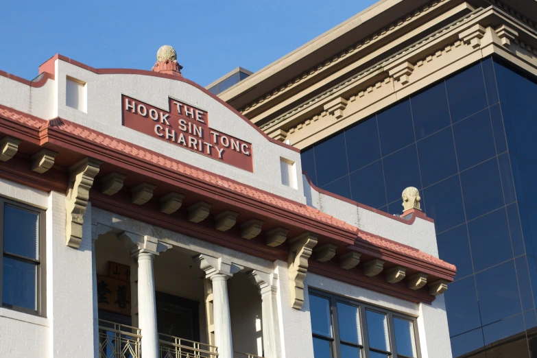 the front of a building with two columns and an american flag on it