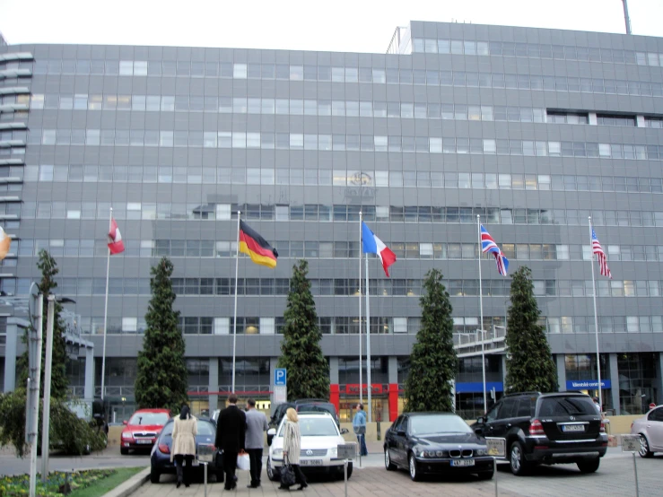 an european building with flags in front