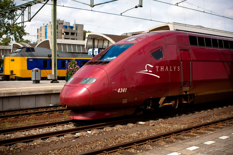 a bullet train on the tracks at the station