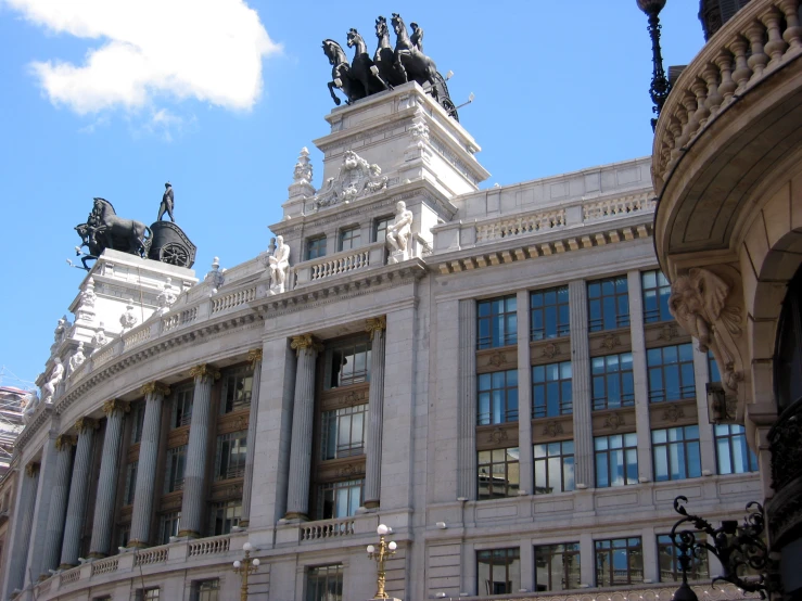 an old building with some sculptures on top of it