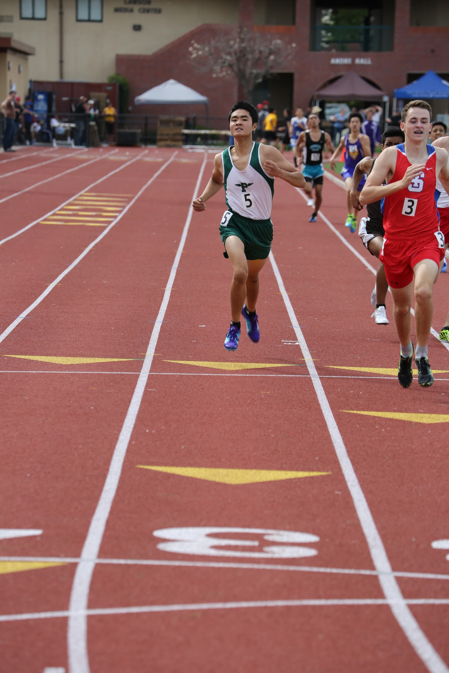 two men running in a race in a field