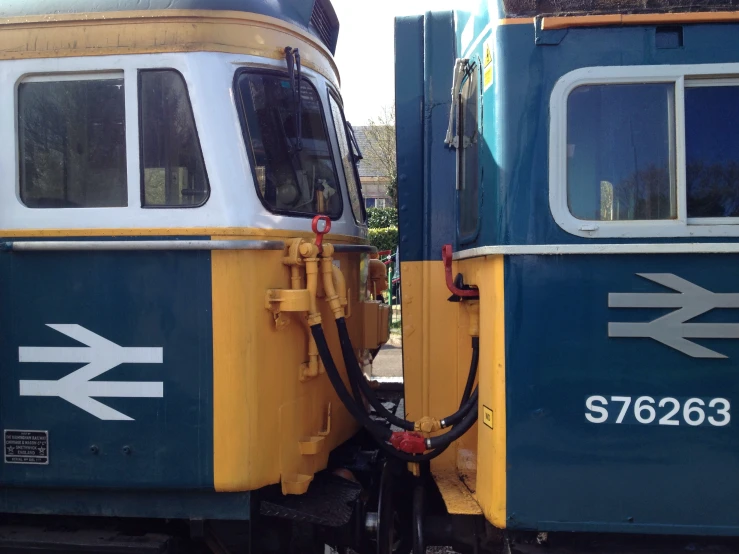 two old train cars with signs on the windows