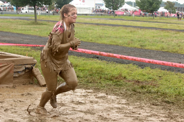 a  is playing in mud