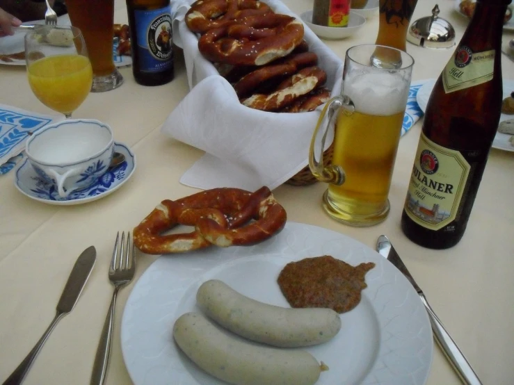 sausages, beer, and sausage rings on a table