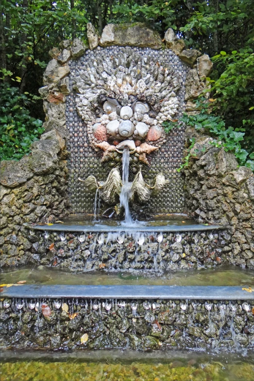 a large stone structure that is in a forest