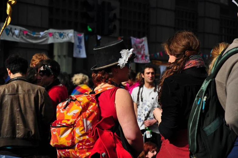 a large group of people standing on a street