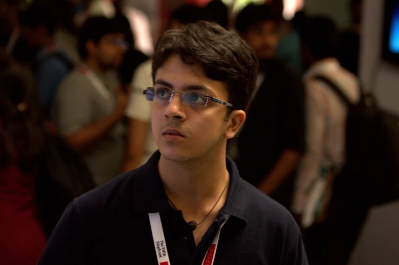 a man stands in front of a group of people