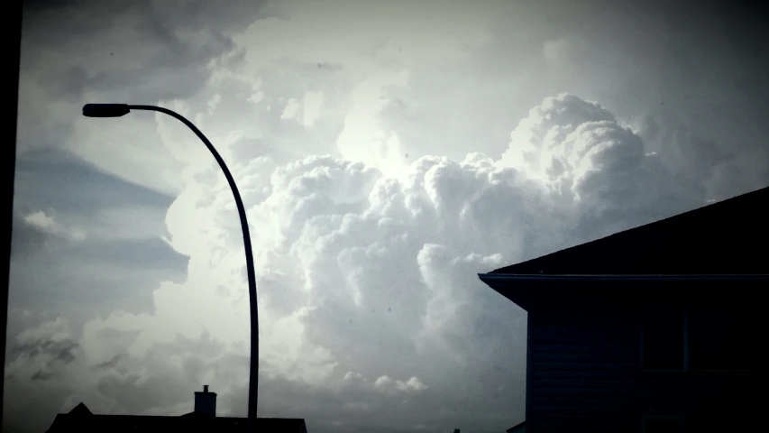 the clouds are big and gray at the intersection