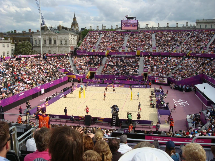 a large volleyball court inside of an arena