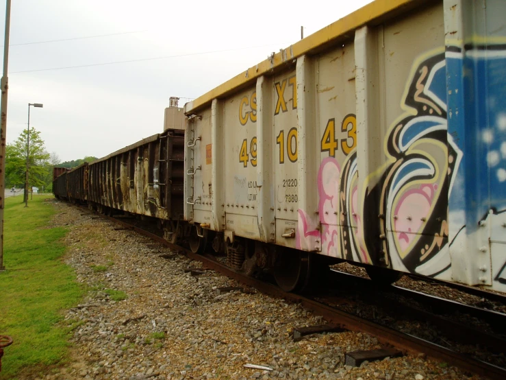 train car with many graffiti written on it