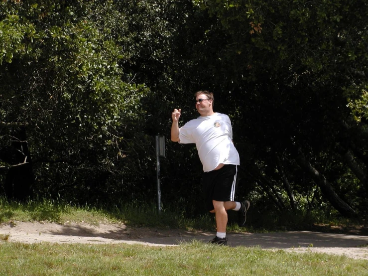 man wearing all white running up to the camera