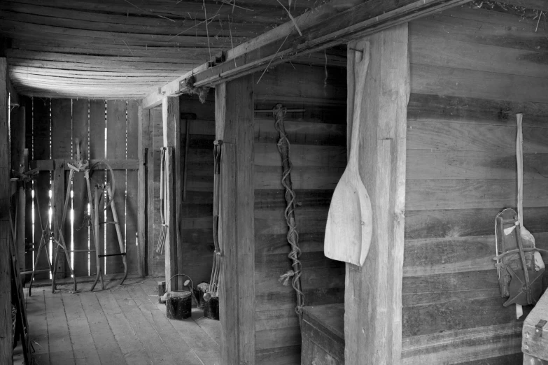 an old wooden building with a door and a towel hanging on it