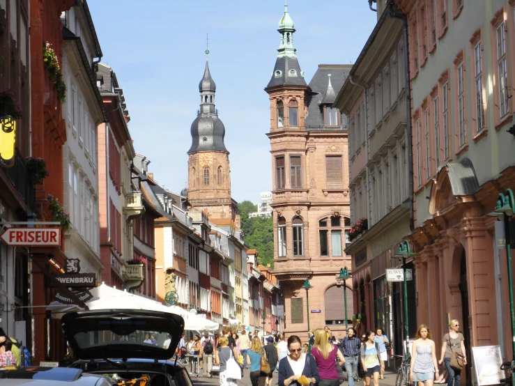 the street scene has people walking down it