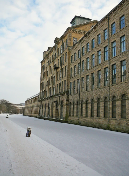 some snow and buildings under a blue sky