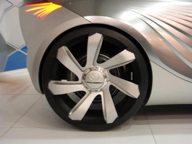 the wheels of a futuristic car on display