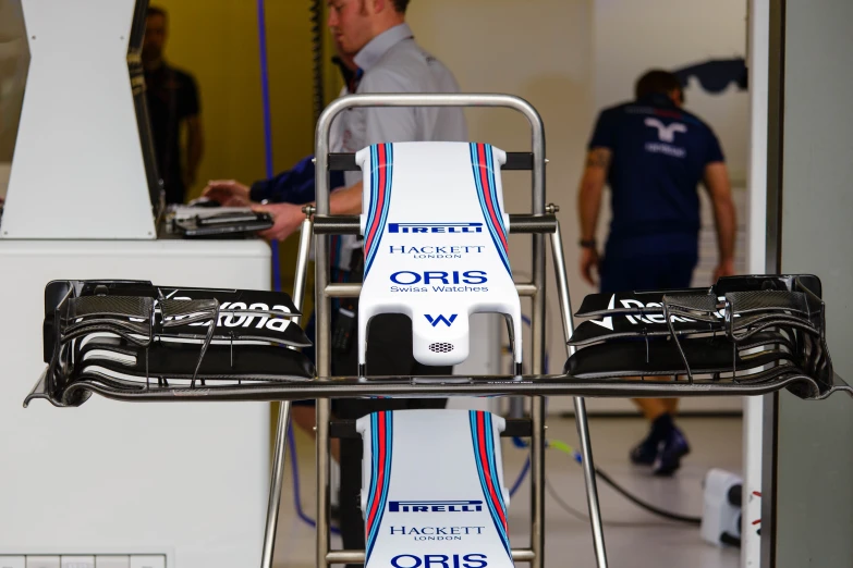 a car sits on a cart being tested