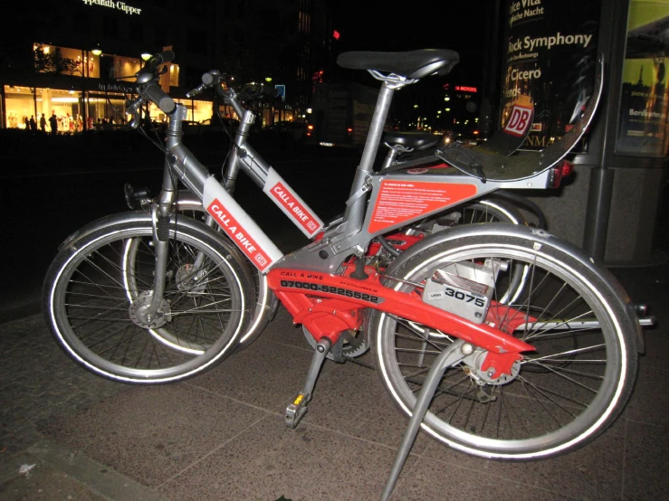 a bicycle parked on the street at night