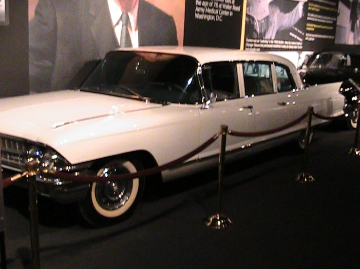an antique car in the museum is being displayed