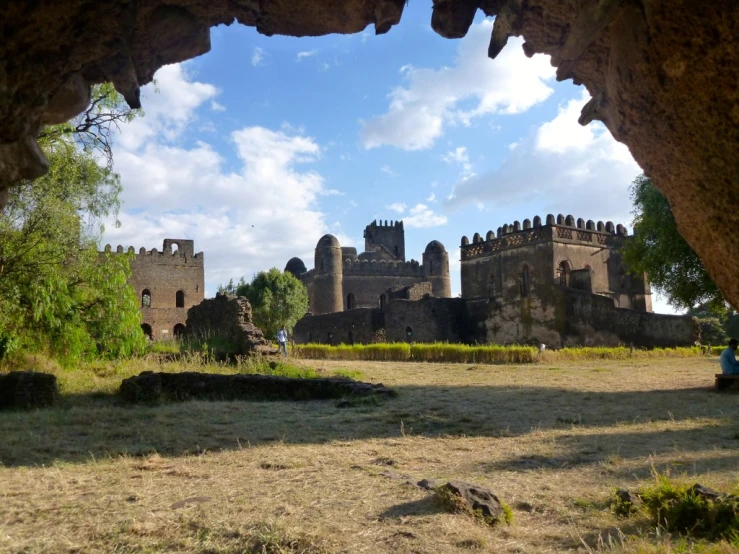 an abandoned castle, as seen through a stone structure