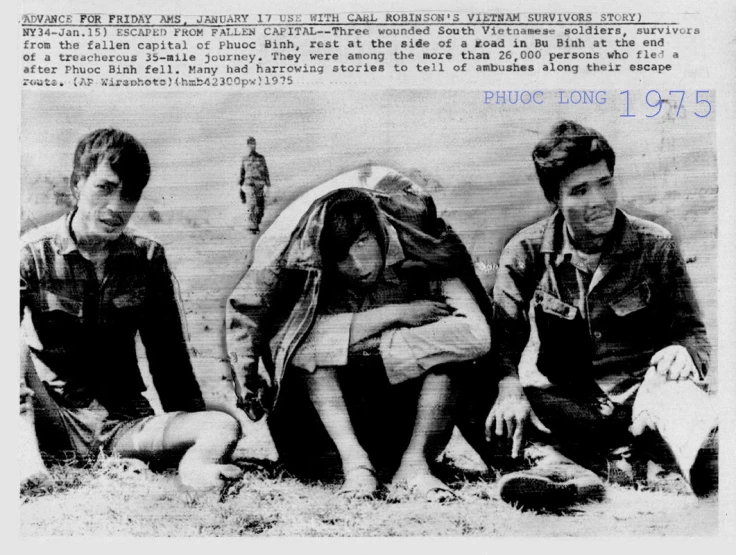 black and white image of three people sitting near a body of water