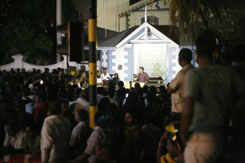 the stage is on in front of a crowd of people