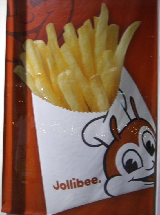 a french fries in the wrapping paper with writing jollibee