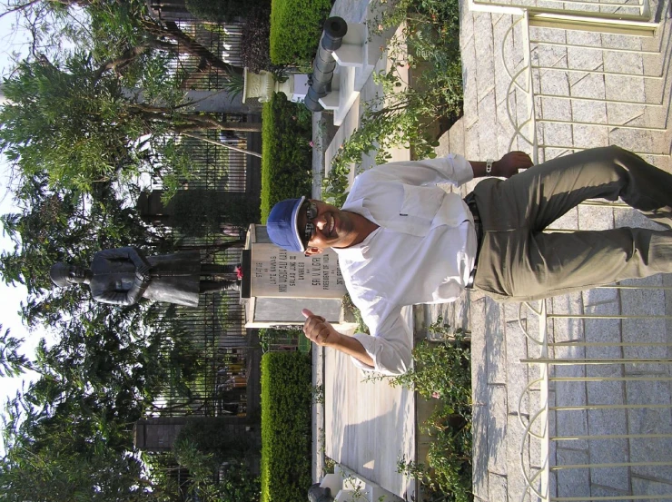 a man that is standing by some concrete