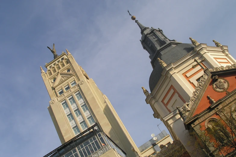 there are a few tall buildings with clocks on them