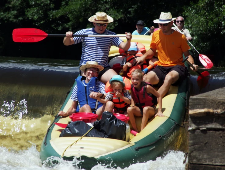 group of people enjoying canoe ride on a river