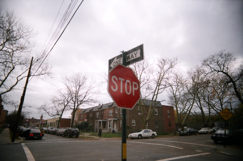 there are several cars parked along this street