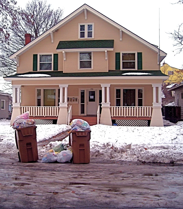 two pieces of furniture sitting in front of a house