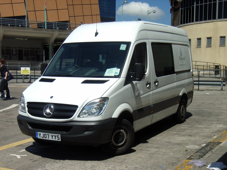 the van is parked in the empty parking lot