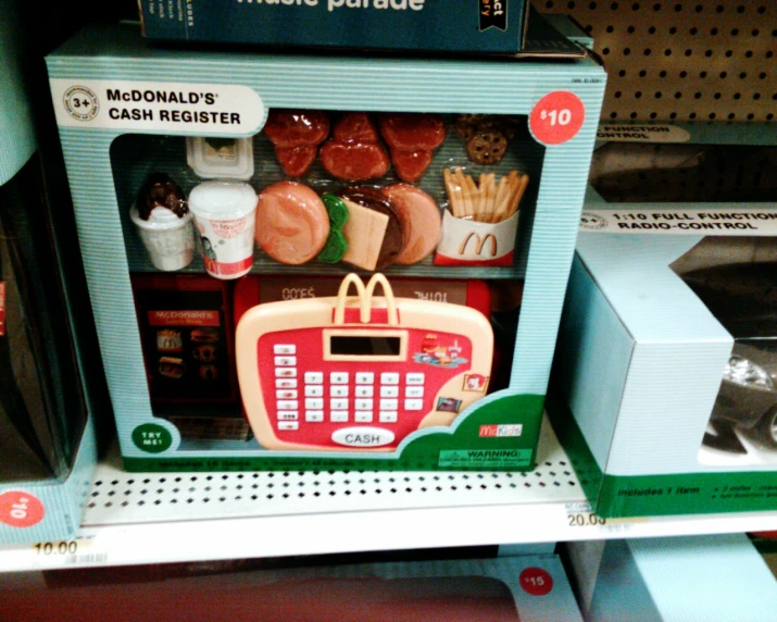 this toy cash register is on the shelf