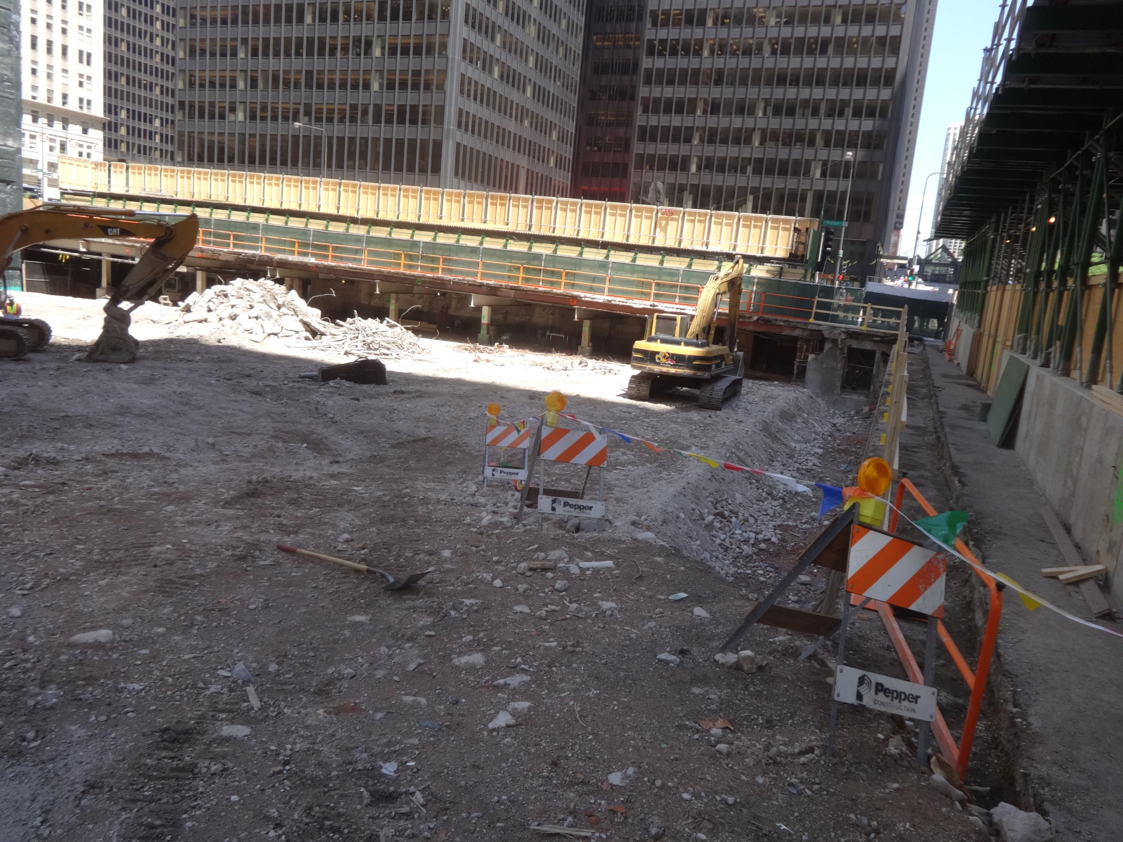 a road is under construction with one man standing in front of the road