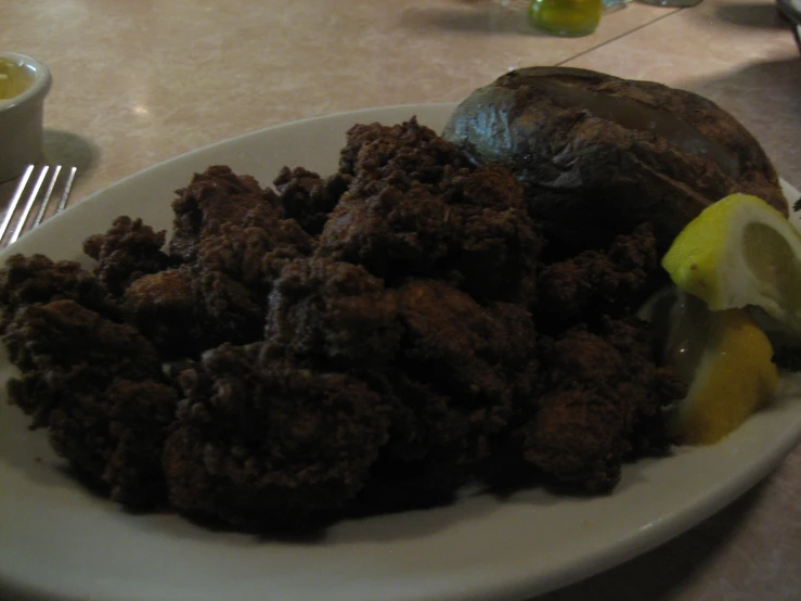 a plate with some kind of cooked food on it