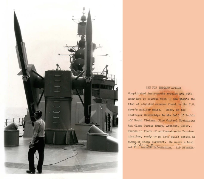 a military man standing in front of a submarine