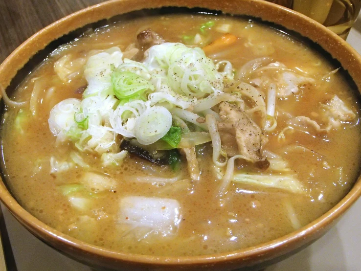an image of a bowl of soup with meat and veggies