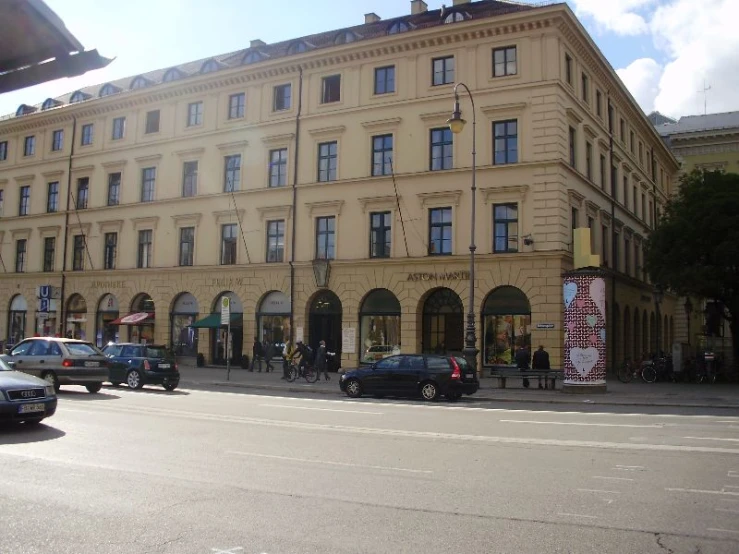 a building in the middle of the street next to traffic