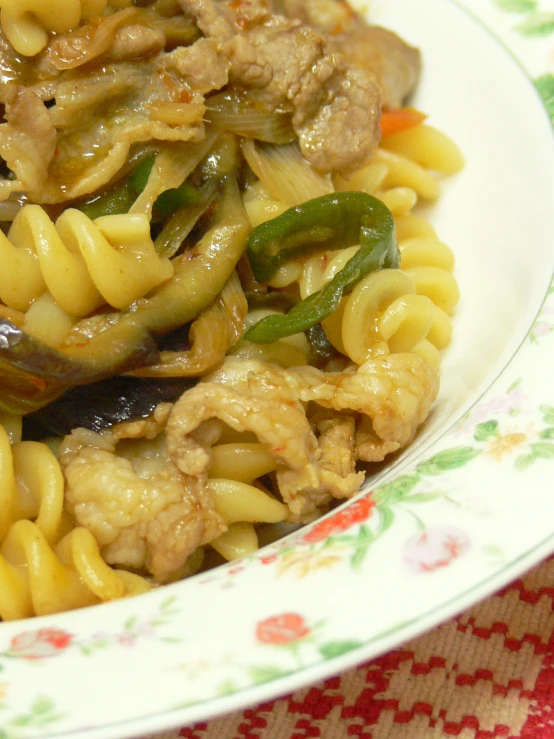 a plate of food with meat and noodles