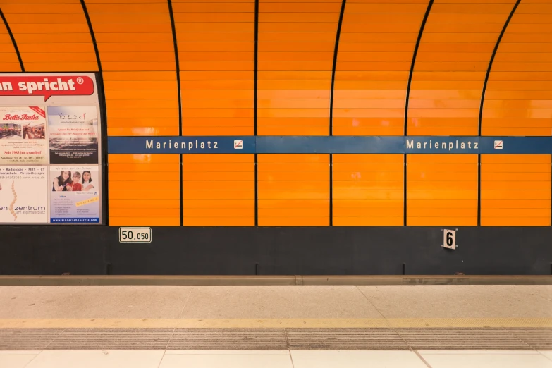 an airport with orange and black walls is pictured