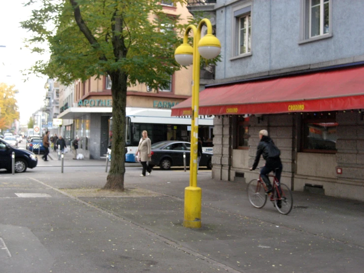 there are people riding bikes down the street