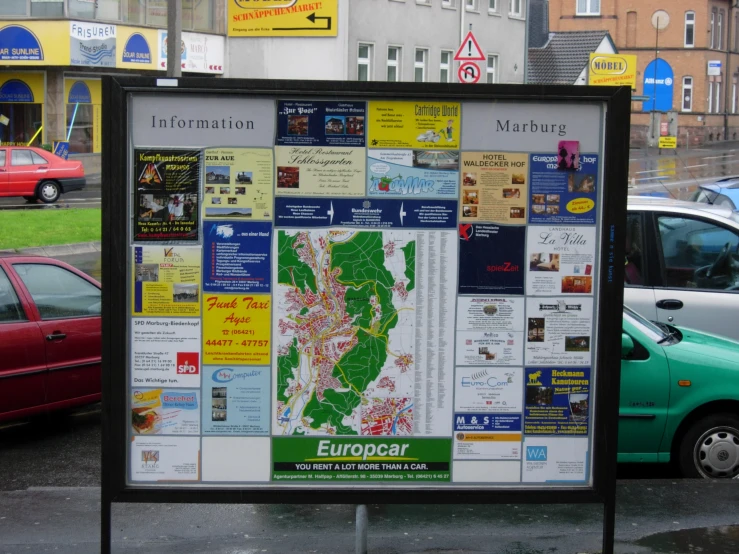 a bus stop covered in lots of paper